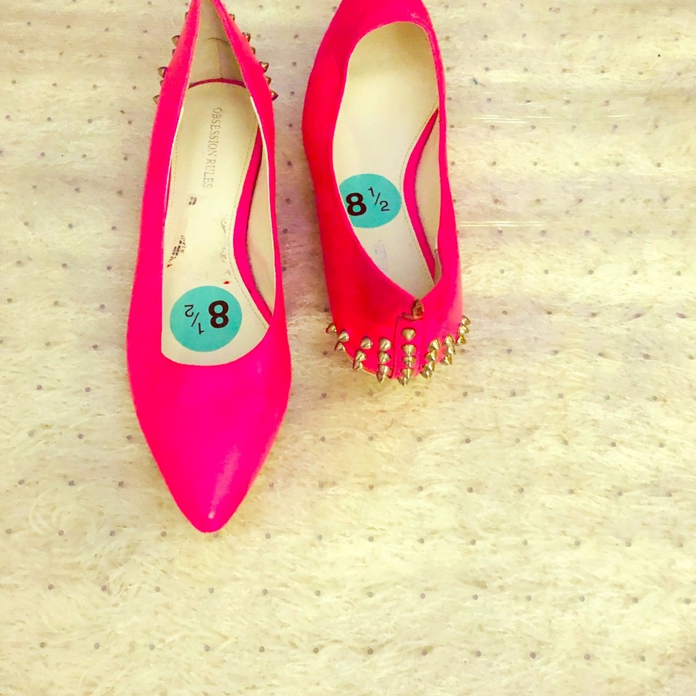 Pink  pointy flats with spikes. Size 8.5